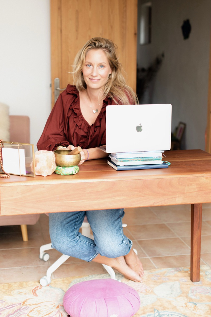 Orama at her desk in her home on Ibiza